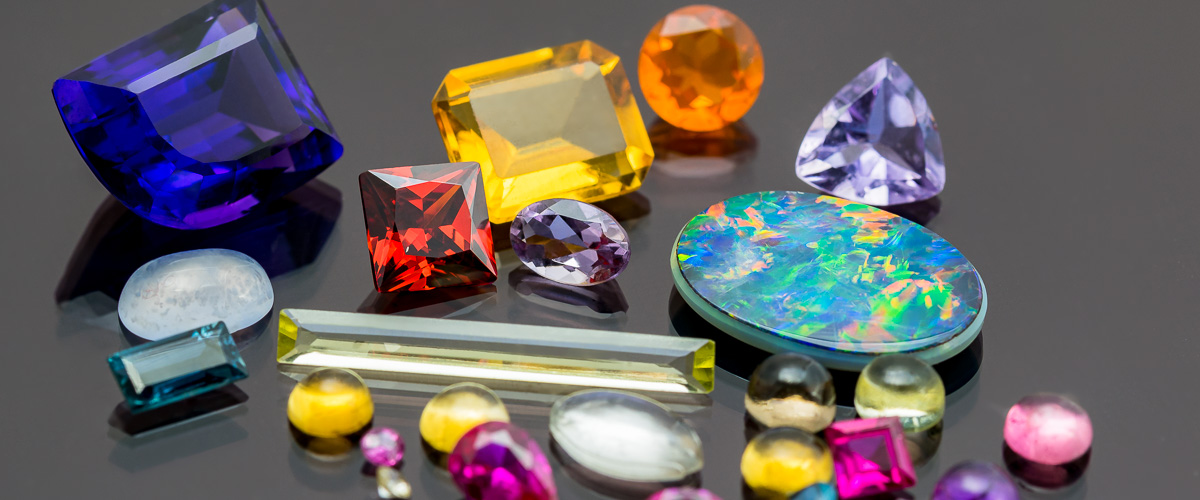 Collection of colourful gemstones in different shapes and sizes