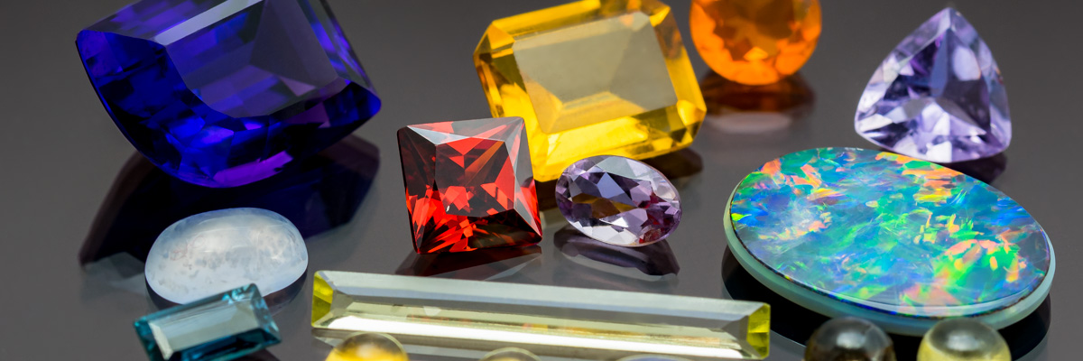 Collection of colourful gemstones in different shapes and sizes