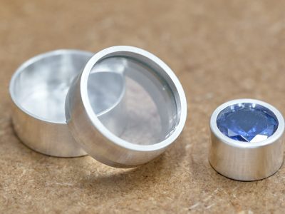 Silver back set glass keepsake box and silver back set gemstone.