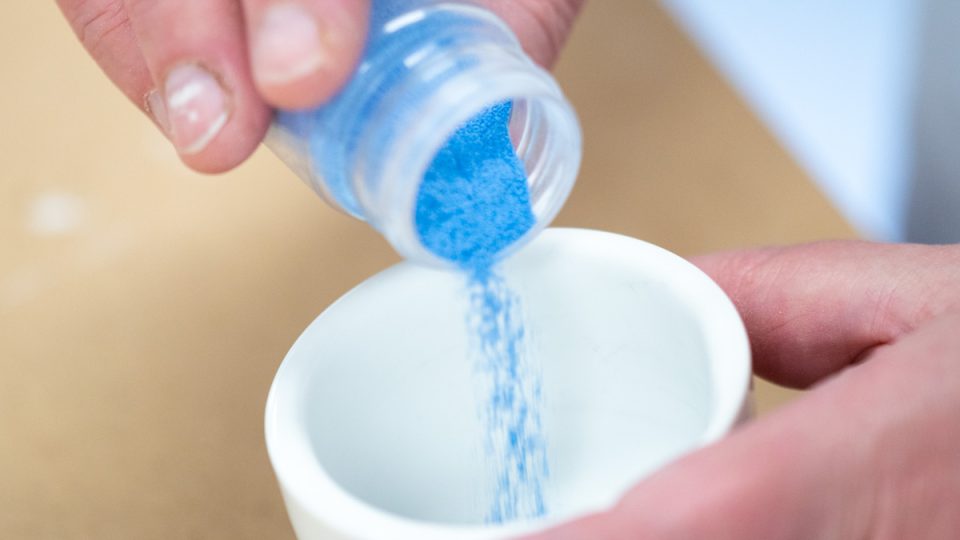 Enamel being poured into a ceramic bowl