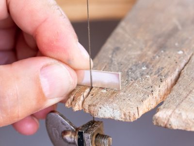 Silver jewellery making sawing silver