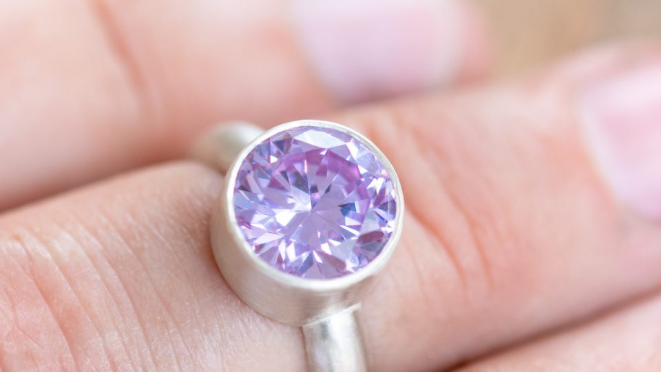 Silver ring with large faceted stone