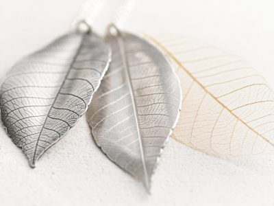 Oxidised and plain silver leaf pendants with a skeleton leaf
